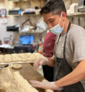 Man rolling dough