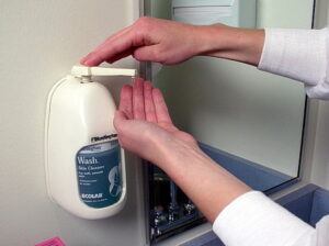 Photo of man washing hands